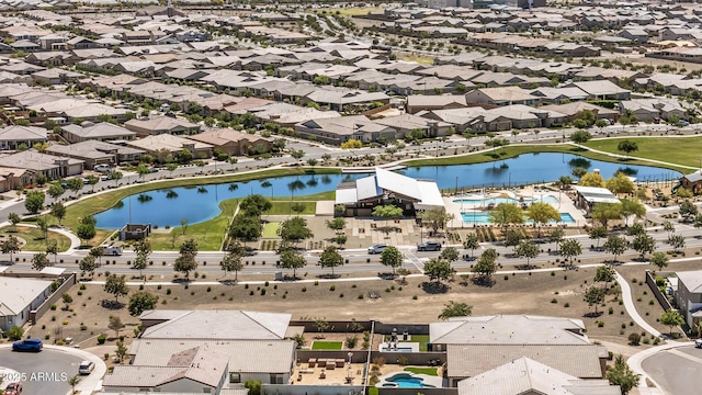drone / aerial view featuring a residential view and a water view