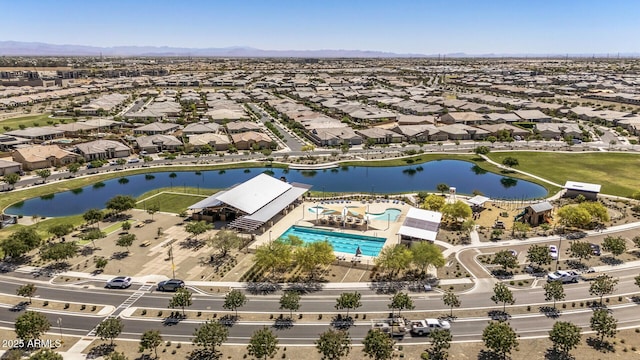 aerial view featuring a water and mountain view and a residential view