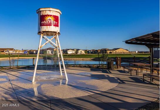 view of property's community with a residential view and a water view