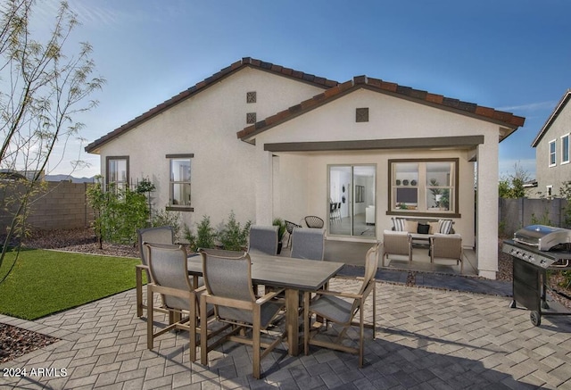 view of patio with grilling area and a fireplace