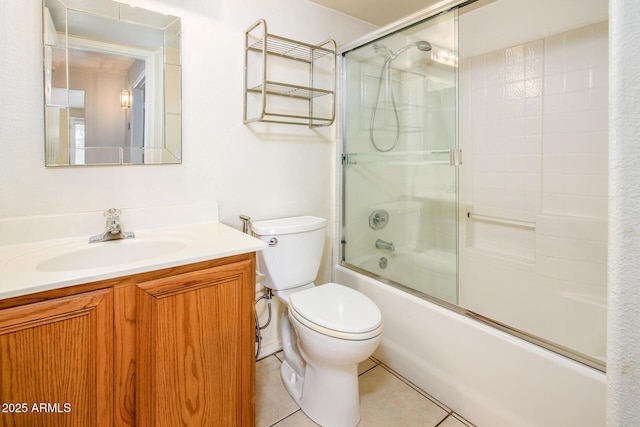 full bathroom with vanity, tile patterned floors, enclosed tub / shower combo, and toilet