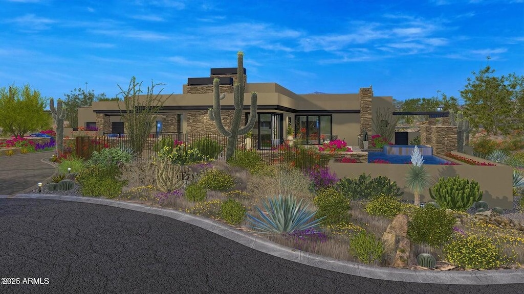 rear view of property with stucco siding