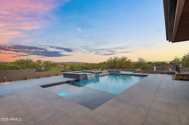 10354 E Celestial Dr, Scottsdale, AZ 85262 - pool at dusk with a patio, fence, and a pool with connected hot tub