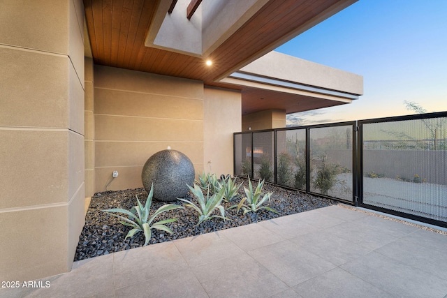 10354 E Celestial Dr, Scottsdale, AZ 85262 - patio terrace at dusk with a balcony