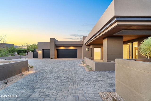 10354 E Celestial Dr, Scottsdale, AZ 85262 - view of front of house with stucco siding, an attached garage, and decorative driveway