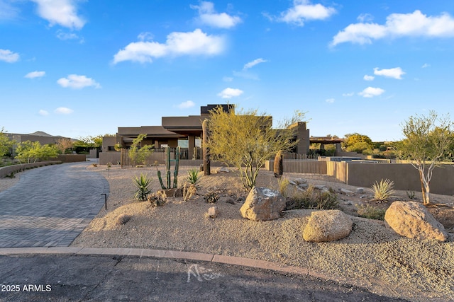 10354 E Celestial Dr, Scottsdale, AZ 85262 - pueblo revival-style home with fence and stucco siding