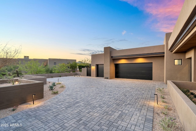 10354 E Celestial Dr, Scottsdale, AZ 85262 - view of front facade featuring a garage, stucco siding, and driveway