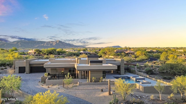 10354 E Celestial Dr, Scottsdale, AZ 85262 - modern home featuring stucco siding, a mountain view, and an in-ground hot tub