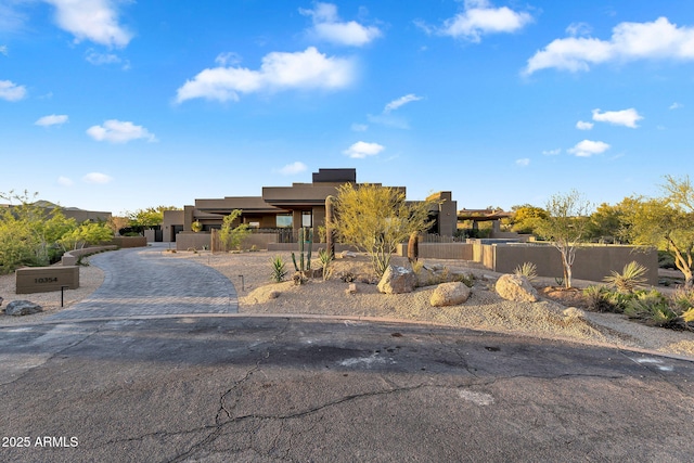 10354 E Celestial Dr, Scottsdale, AZ 85262 - pueblo revival-style home with stucco siding and driveway