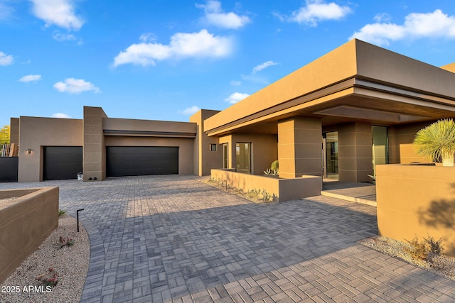 10354 E Celestial Dr, Scottsdale, AZ 85262 - view of front of property featuring stucco siding, an attached garage, and driveway