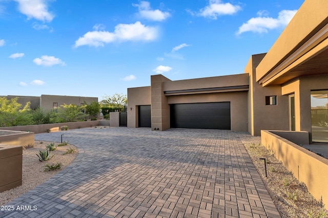 10354 E Celestial Dr, Scottsdale, AZ 85262 - view of front of property featuring a garage, decorative driveway, and stucco siding