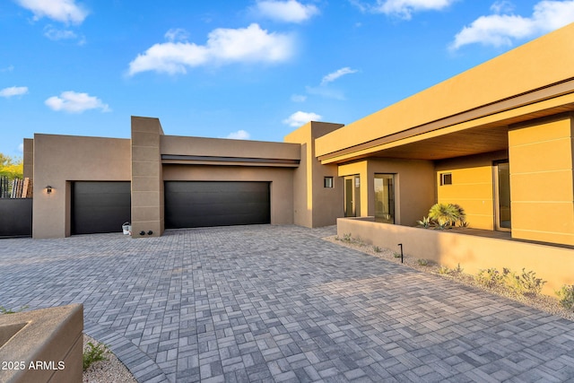 10354 E Celestial Dr, Scottsdale, AZ 85262 - pueblo-style home with driveway, a garage, and stucco siding
