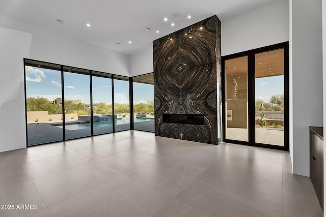 10354 E Celestial Dr, Scottsdale, AZ 85262 - unfurnished living room featuring a high ceiling and recessed lighting