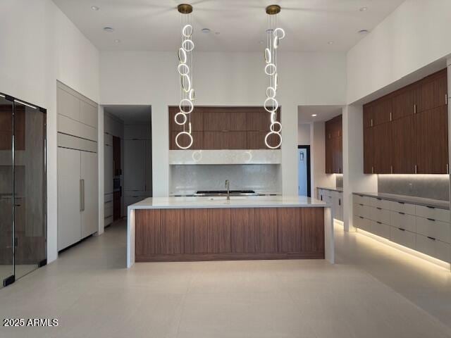 10354 E Celestial Dr, Scottsdale, AZ 85262 - kitchen featuring modern cabinets, light countertops, and a sink