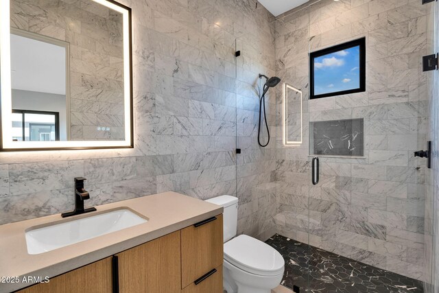 10354 E Celestial Dr, Scottsdale, AZ 85262 - bathroom with a shower stall, toilet, tile walls, and vanity