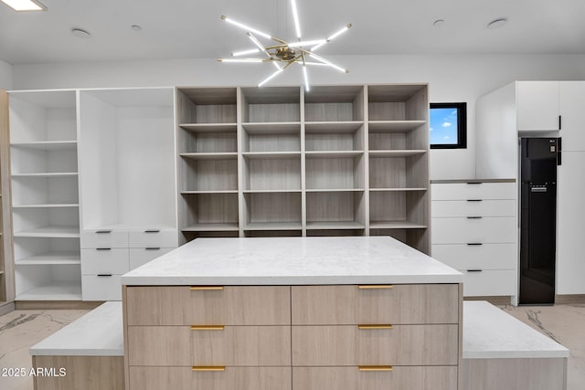 10354 E Celestial Dr, Scottsdale, AZ 85262 - walk in closet with light marble finish flooring and a chandelier