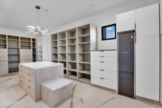 10354 E Celestial Dr, Scottsdale, AZ 85262 - spacious closet featuring light marble finish floors, a chandelier, and a heating unit