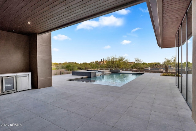 10354 E Celestial Dr, Scottsdale, AZ 85262 - view of swimming pool featuring a patio and a pool with connected hot tub