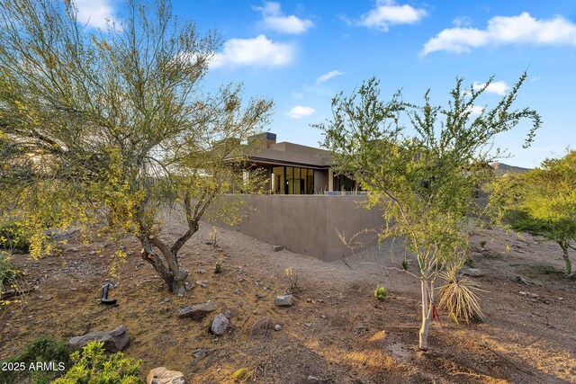 10354 E Celestial Dr, Scottsdale, AZ 85262 - view of side of home featuring stucco siding