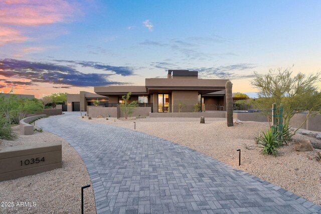 10354 E Celestial Dr, Scottsdale, AZ 85262 - southwest-style home featuring a fenced front yard, stucco siding, and driveway