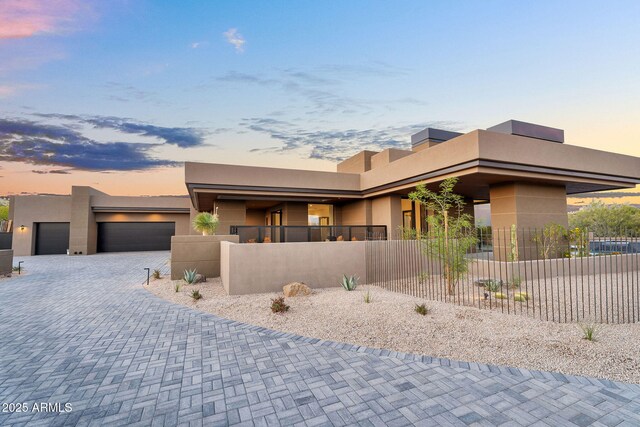 10354 E Celestial Dr, Scottsdale, AZ 85262 - view of front of property featuring stucco siding, an attached garage, and decorative driveway