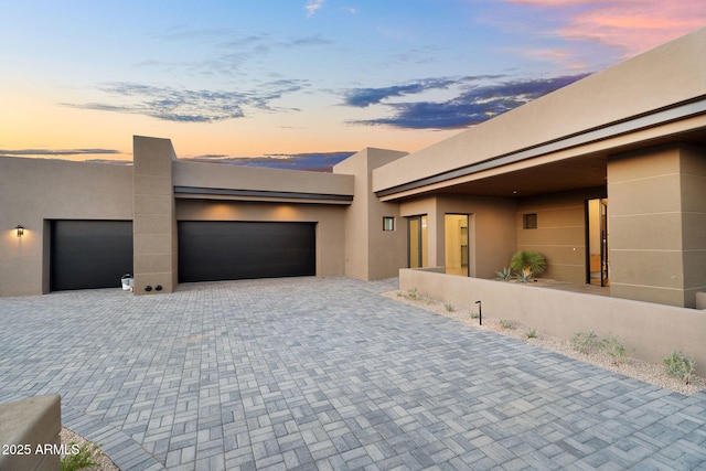 10354 E Celestial Dr, Scottsdale, AZ 85262 - view of front facade with decorative driveway, stucco siding, and an attached garage