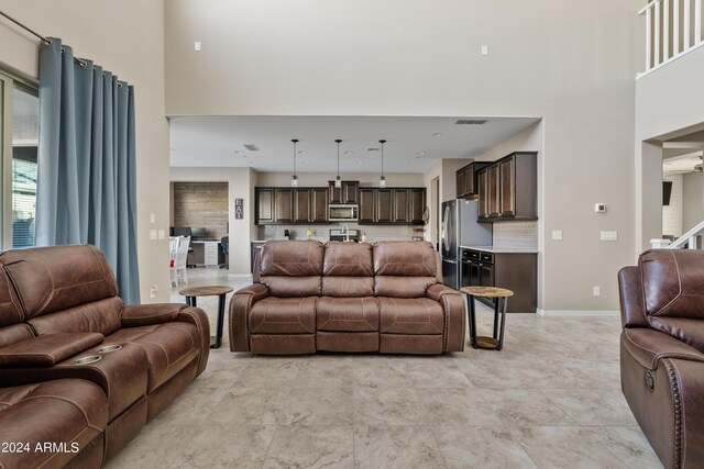 living room featuring a high ceiling