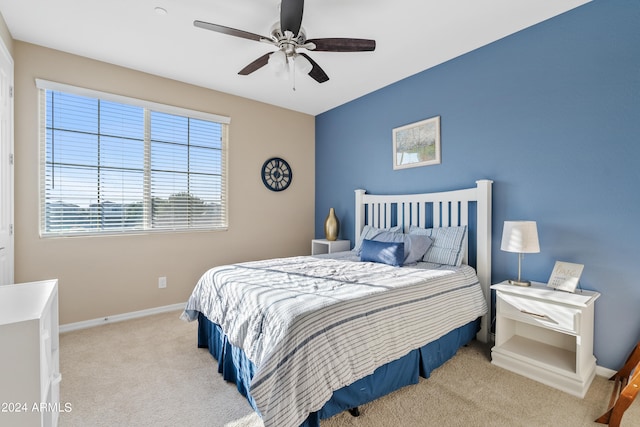 bedroom featuring ceiling fan and light colored carpet