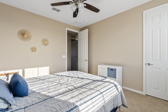 bedroom with light carpet and ceiling fan