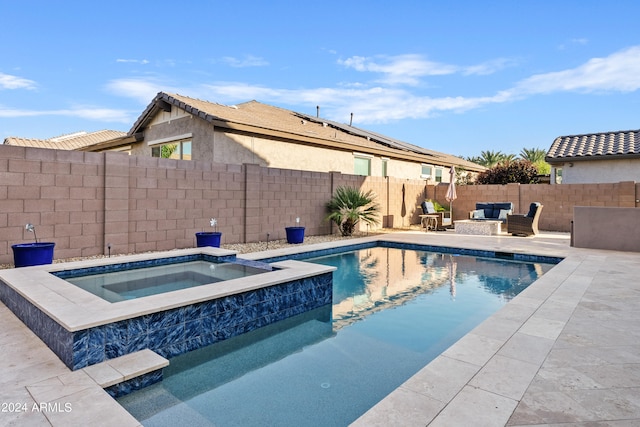 view of swimming pool featuring an in ground hot tub and a patio area