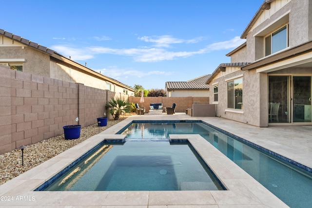 view of swimming pool with a patio area