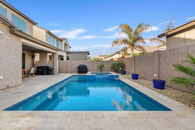 view of swimming pool with a patio area