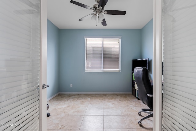 office space featuring light tile patterned flooring and ceiling fan