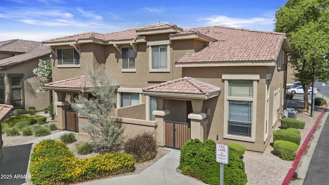 1225 N 36th St Unit 1015, Phoenix, AZ 85008 - view of front of property with a tile roof and stucco siding
