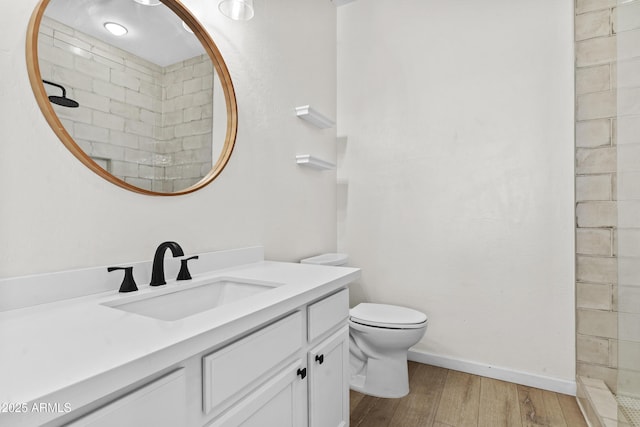 1225 N 36th St Unit 1015, Phoenix, AZ 85008 - full bath with wood finished floors, a tile shower, vanity, toilet, and baseboards