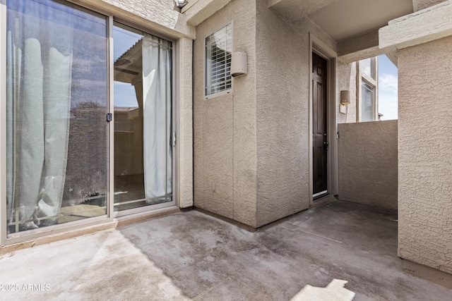 1225 N 36th St Unit 1015, Phoenix, AZ 85008 - doorway to property with stucco siding and a patio area