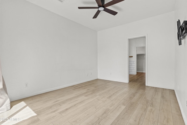 1225 N 36th St Unit 1015, Phoenix, AZ 85008 - spare room with a ceiling fan, light wood finished floors, and baseboards