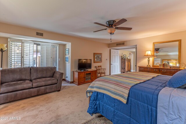 7302 E Rose Ln, Scottsdale, AZ 85250 - carpeted bedroom featuring a ceiling fan