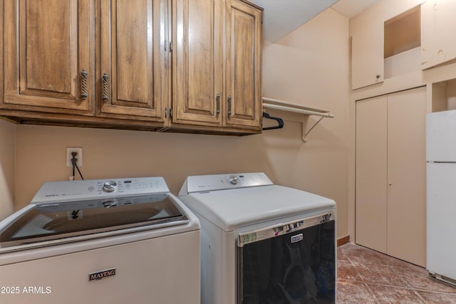 7302 E Rose Ln, Scottsdale, AZ 85250 - washroom with washing machine and clothes dryer and cabinet space