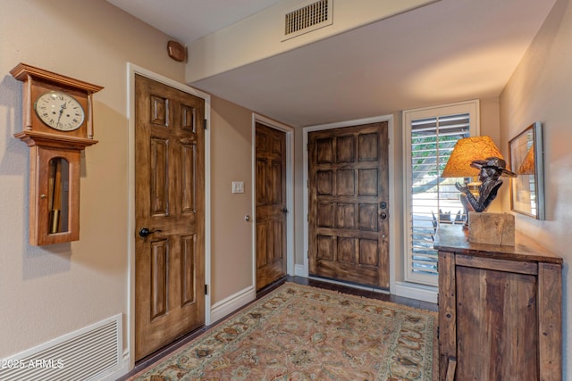 7302 E Rose Ln, Scottsdale, AZ 85250 - foyer with wood finished floors and baseboards