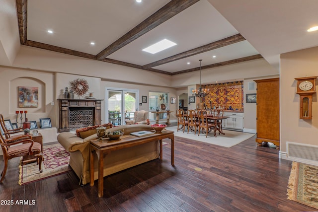 7302 E Rose Ln, Scottsdale, AZ 85250 - living area featuring dark wood finished floors, beam ceiling, baseboards, a fireplace, and recessed lighting