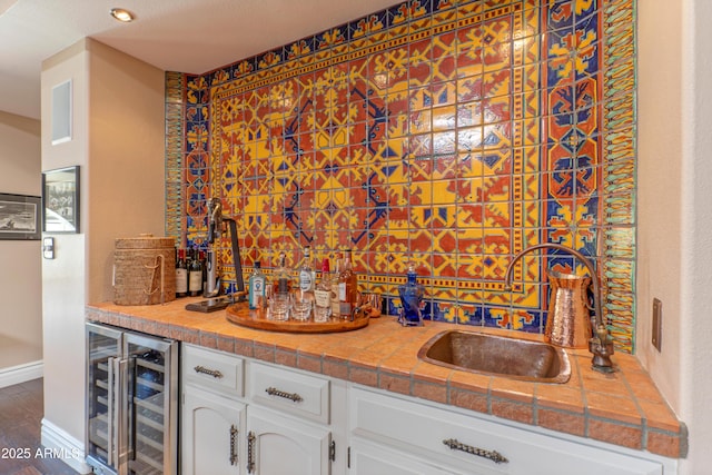 7302 E Rose Ln, Scottsdale, AZ 85250 - indoor wet bar with beverage cooler and wood finished floors