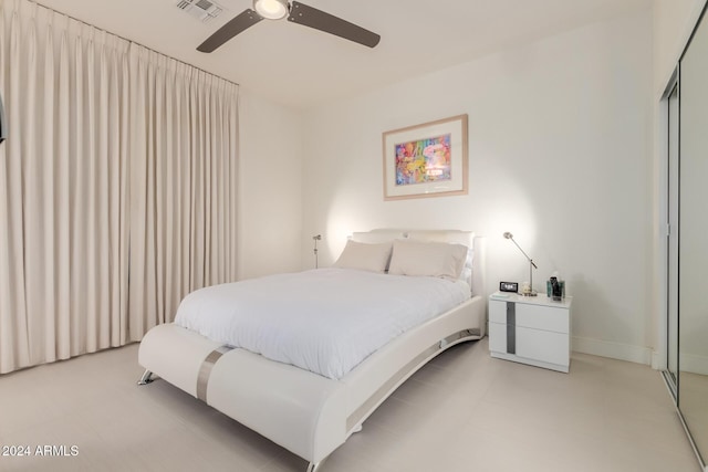 bedroom featuring ceiling fan and a closet