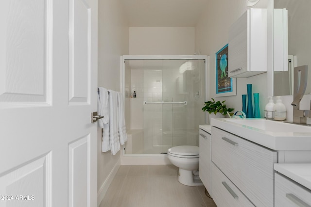 bathroom with vanity, toilet, and walk in shower