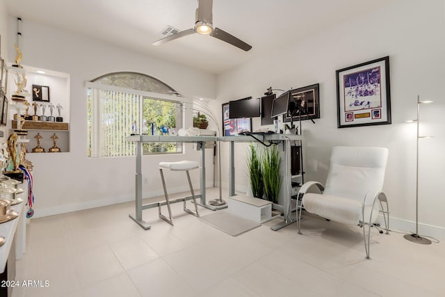 sitting room featuring ceiling fan