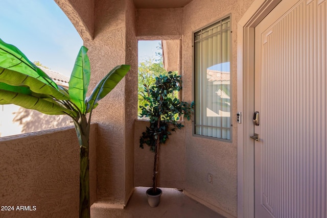 doorway to property featuring a balcony