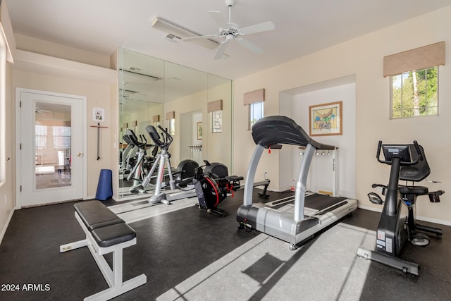 exercise room with ceiling fan