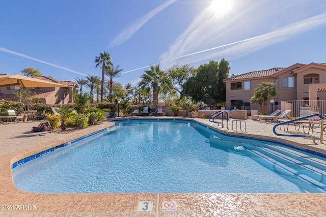 view of swimming pool featuring a patio