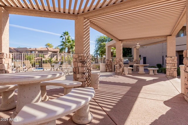 view of patio featuring ceiling fan