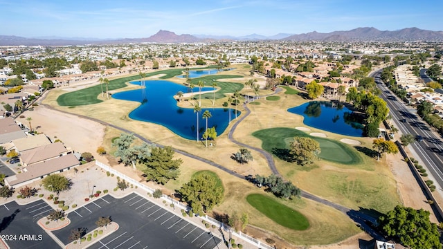 birds eye view of property with a water and mountain view